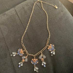 Necklace with blue and peach colored stones